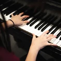 The hands of a musician playing piano.